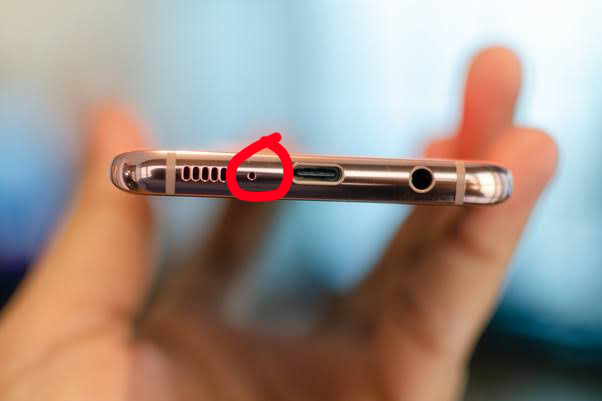 hole next to charging port in tamil 1