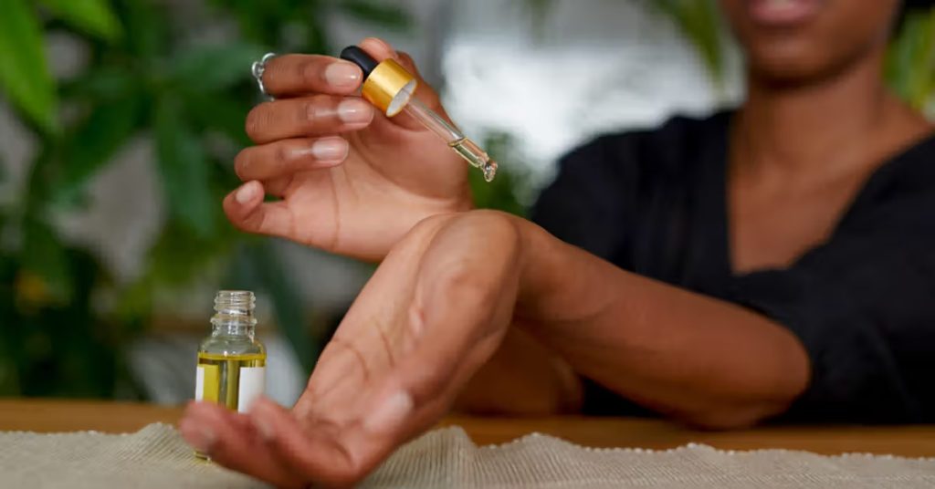 African American Woman putting essential oil on her arm 1296x728 header 1200x628 11zon 1024x536 1