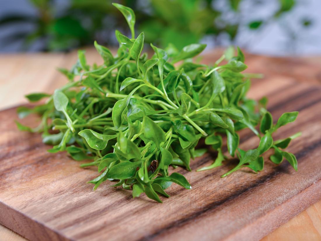 watercress on a chopping board