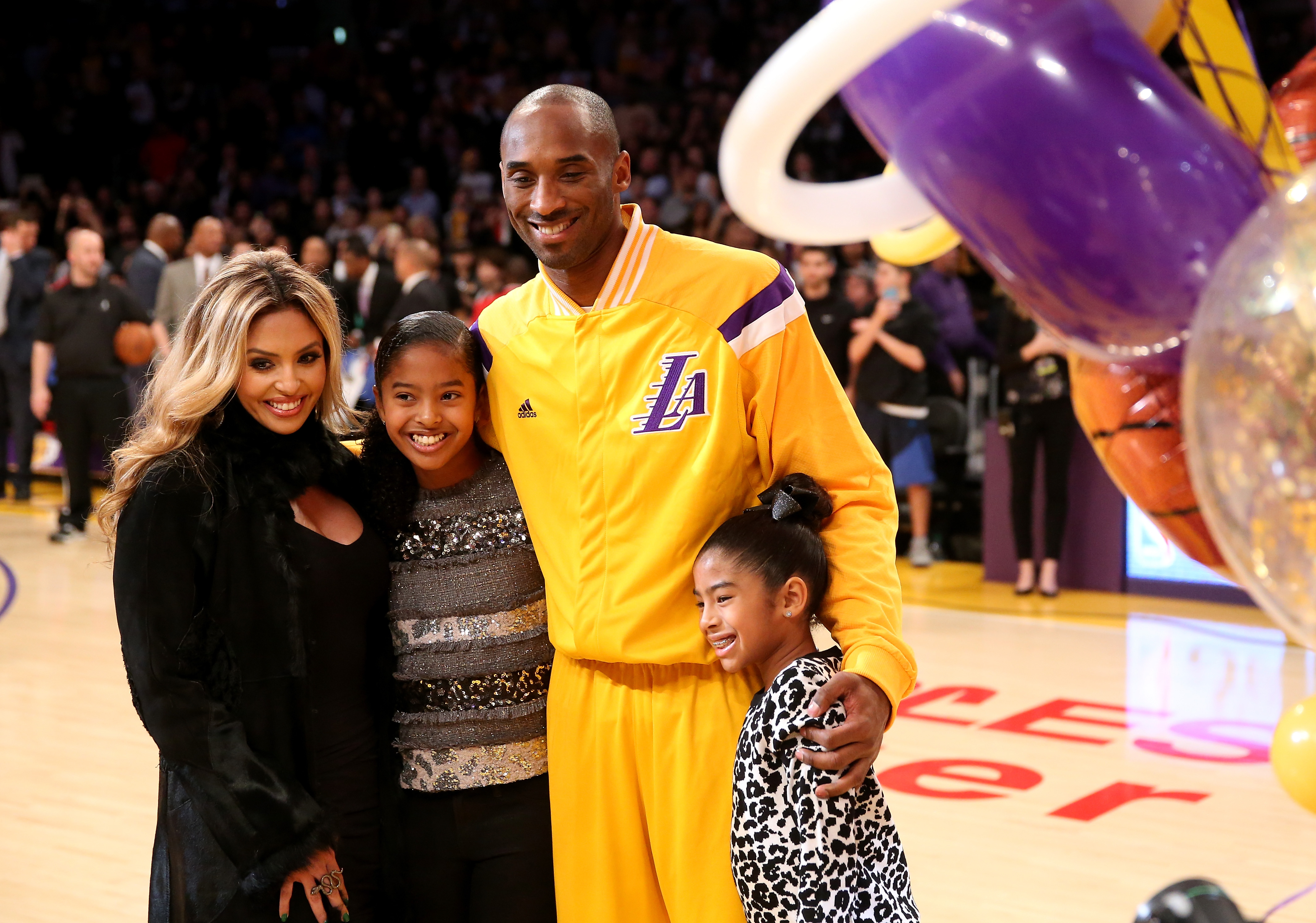 Kobe and Vanessa Bryant with their daughters Gianna and Natalia during a ceremony honoring Kobe for moving into third place on the all-time NBA scoring list and passing Michael Jordan at Staples Center on December 19, 2014, in Los Angeles, California. | Source: Getty Images