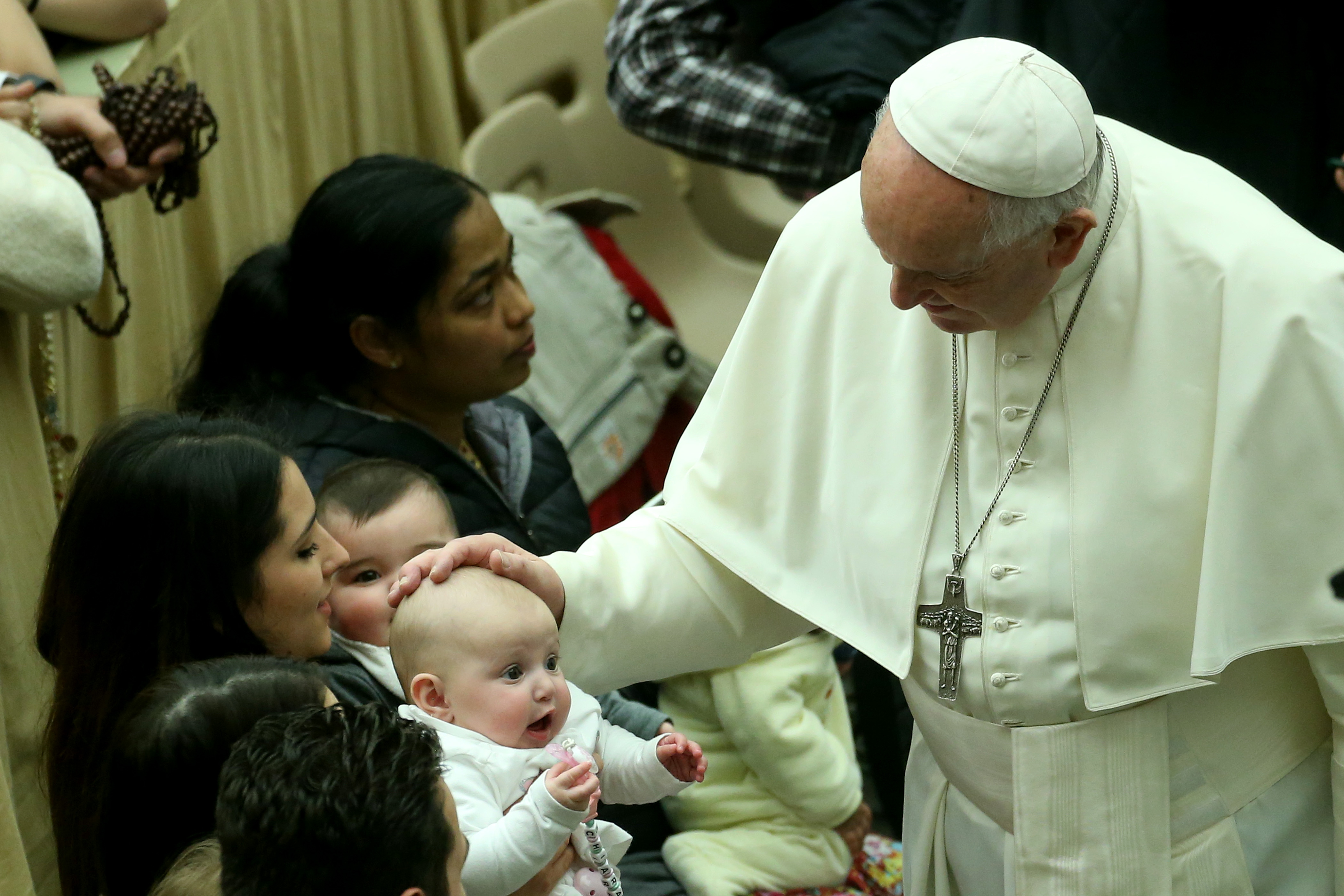 Pope Francis blessing a baby during his weekly audience at the Paul VI Hall on February 12, 2020, in Vatican City. | Source: Getty Images