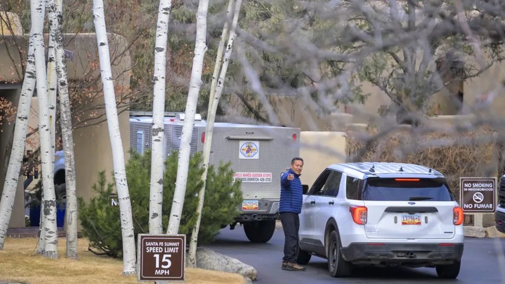 Police at the Santa Fe gated community where the couple were found dead