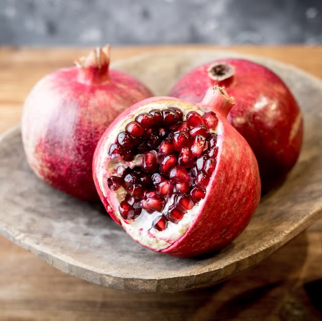 close up of pomegranates on table royalty free image 1701801291 11zon