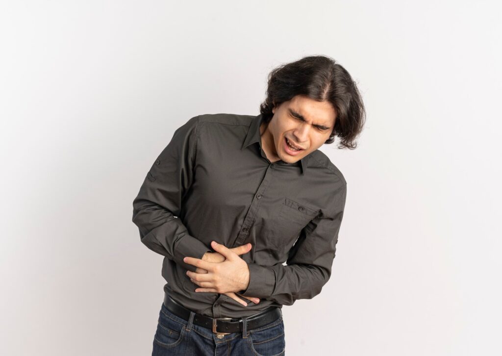 young annoyed handsome caucasian man holds belly with hands isolated white background with copy space 141793 65393 1024x727 1